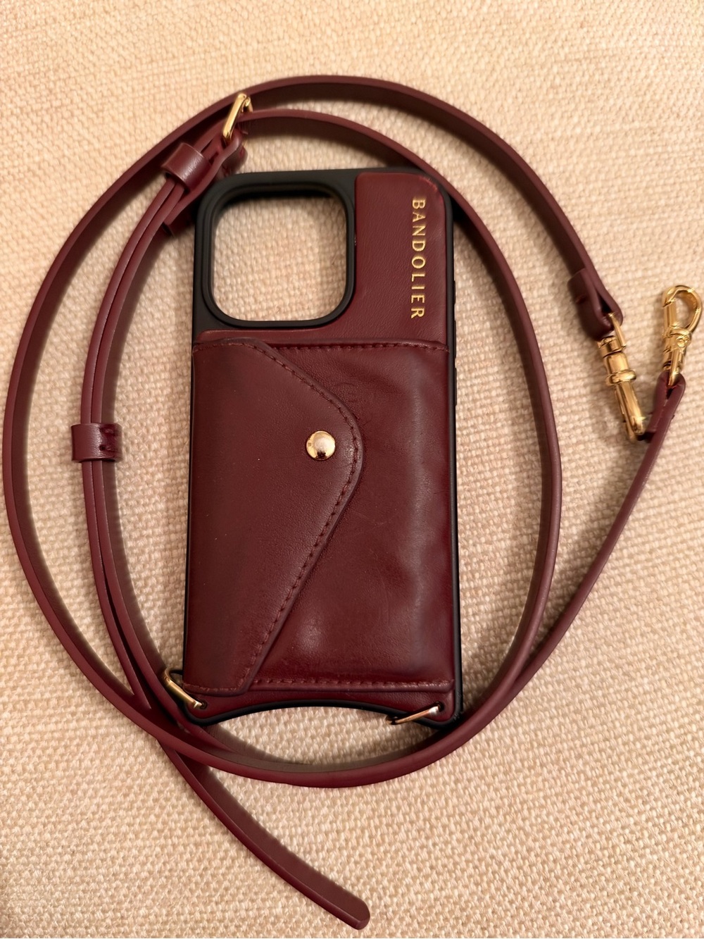 DONNA CROSSBODY PHONE CASE IN WINE/GOLD